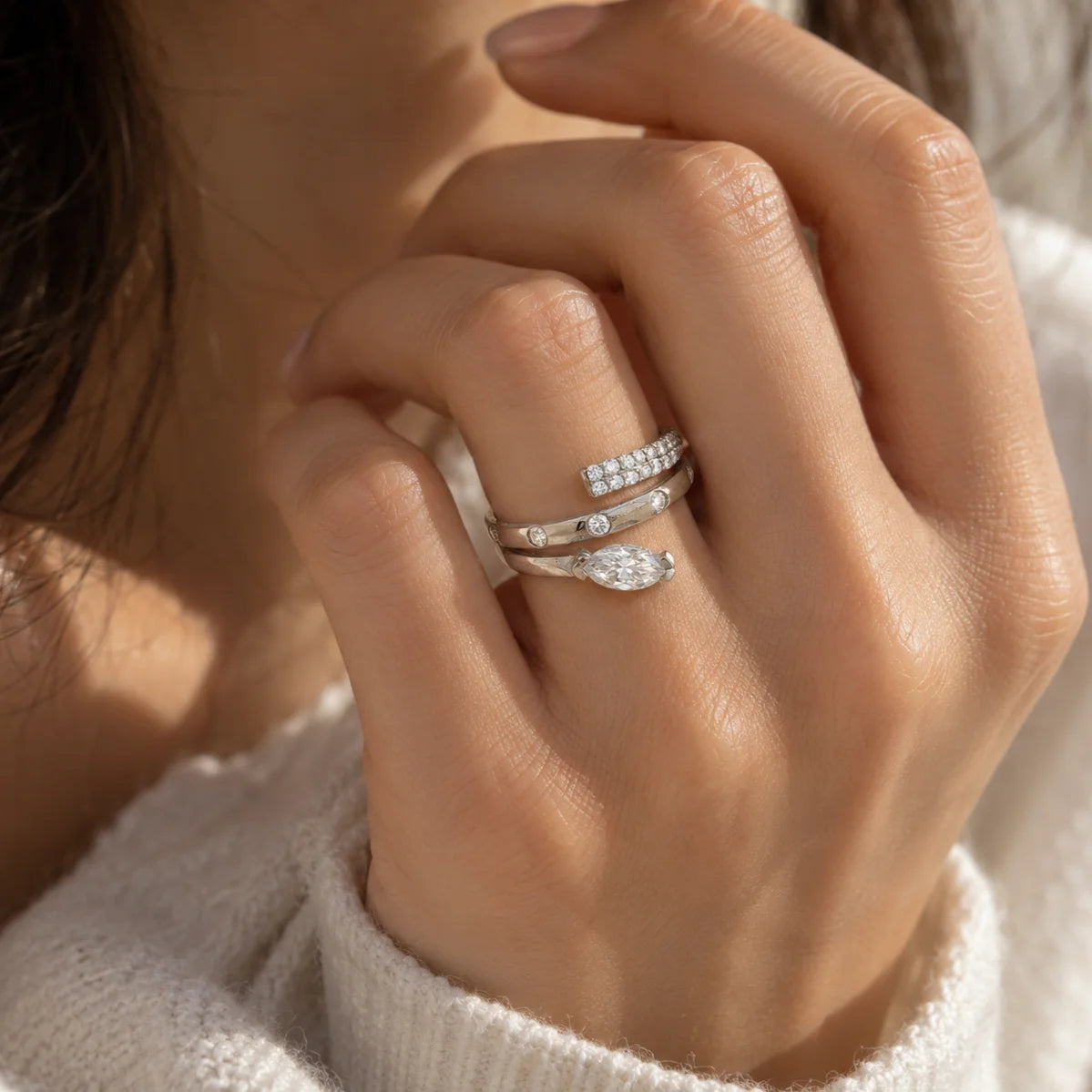 Fashion_ring_in_gold_plated_silver_with_a_spiral_design_and_lab_grown_diamonds_at_front_angle_view_worn_by_a_model
