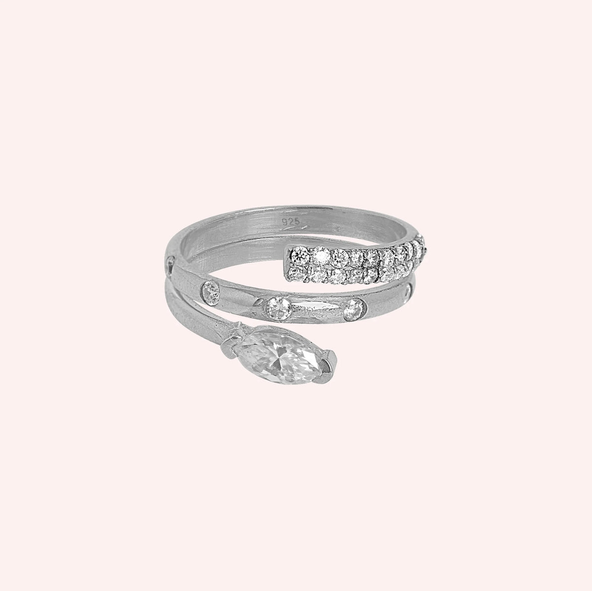 Fashion_ring_in_sterling_silver_with_a_spiral_design_and_lab_grown_diamonds_at_front_angle_view_on_solid_pink_background