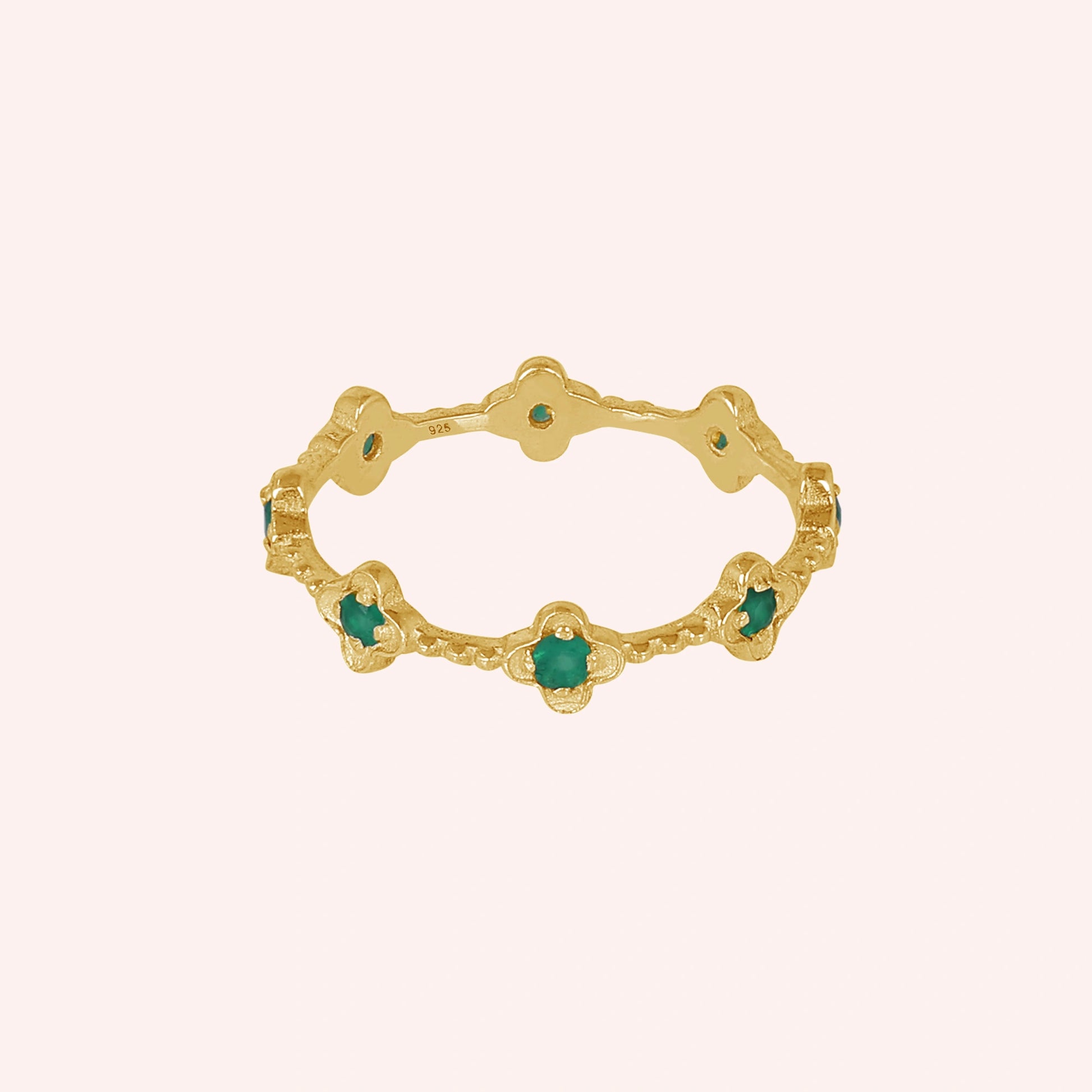 Gold plated sterling silver floral green onyx eternity band ring set with five clover shaped gemstones angled straight product shot.