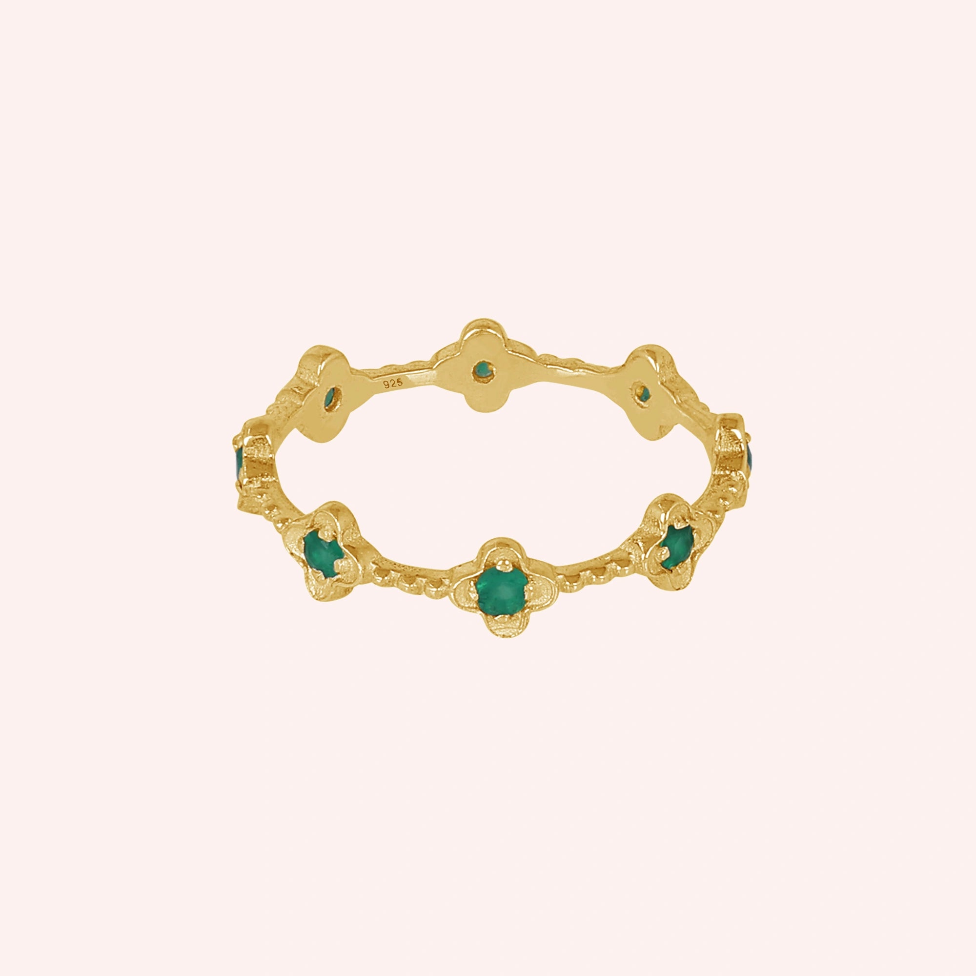 Gold plated sterling silver floral green onyx eternity band ring set with five clover shaped gemstones angled straight product shot.
