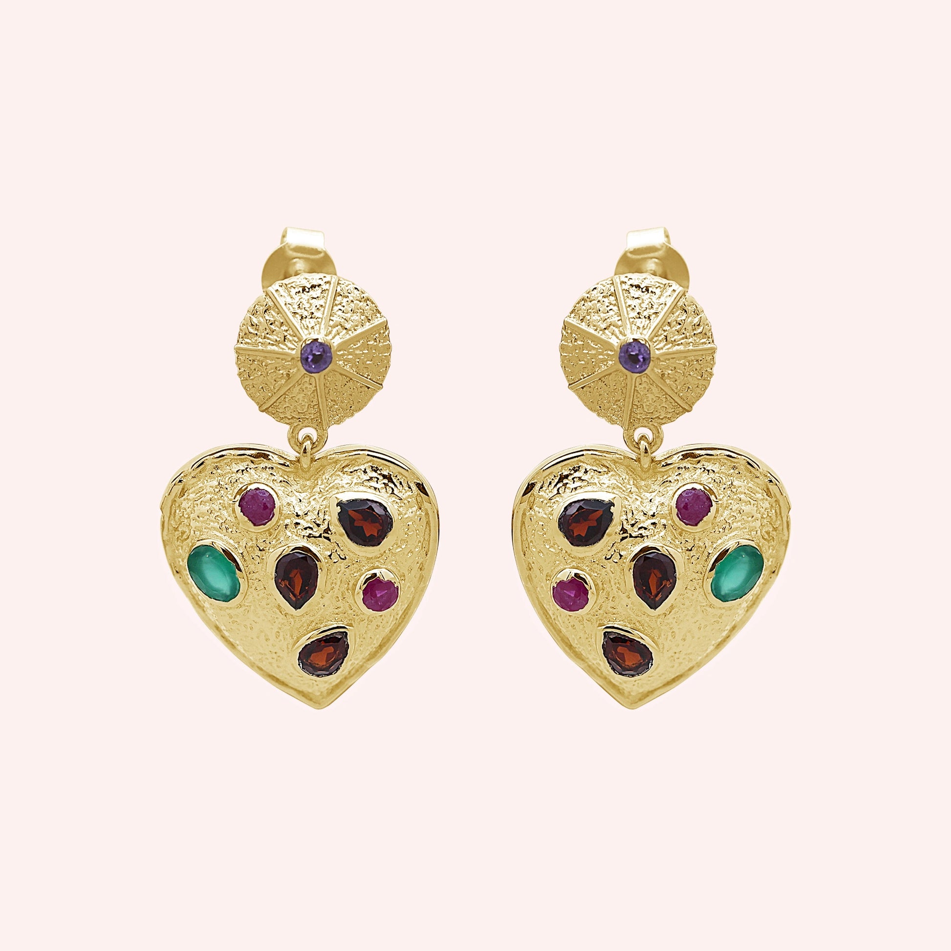 Heart_earrings_in_gold_plated_silver_with_garnet_ruby_and_green_onyx_stones_in_front_angle_on_solid_pink_background