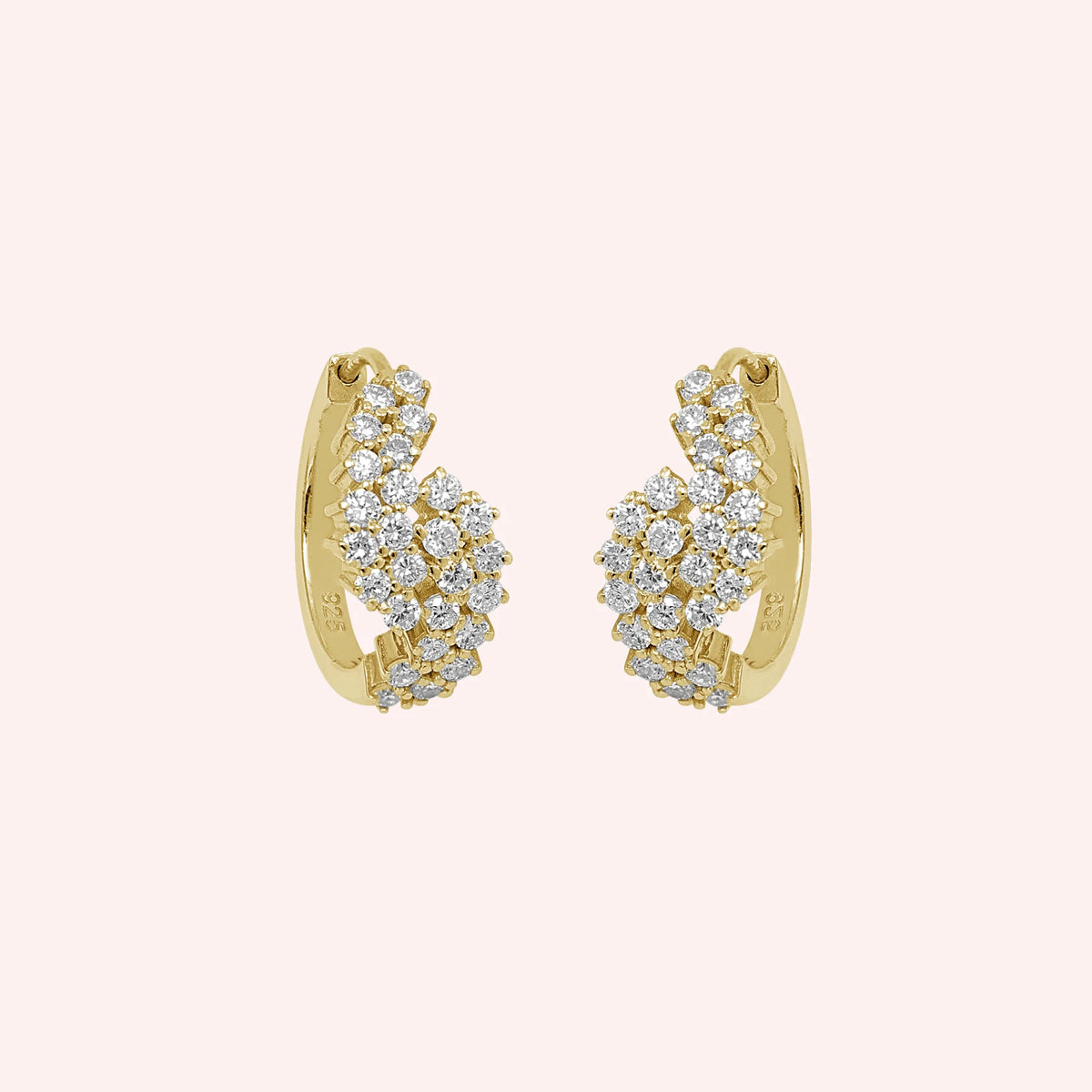 Huggie_earrings_in_gold_plated_silver_with_lab_grown_diamonds_at_front_angle_view_on_solid_pink_background