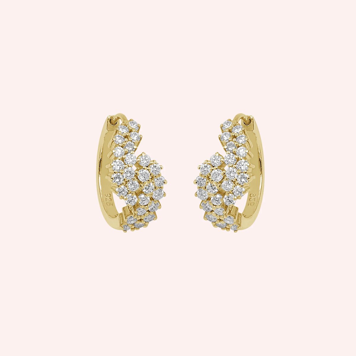 Huggie_earrings_in_gold_plated_silver_with_lab_grown_diamonds_at_front_angle_view_on_solid_pink_background