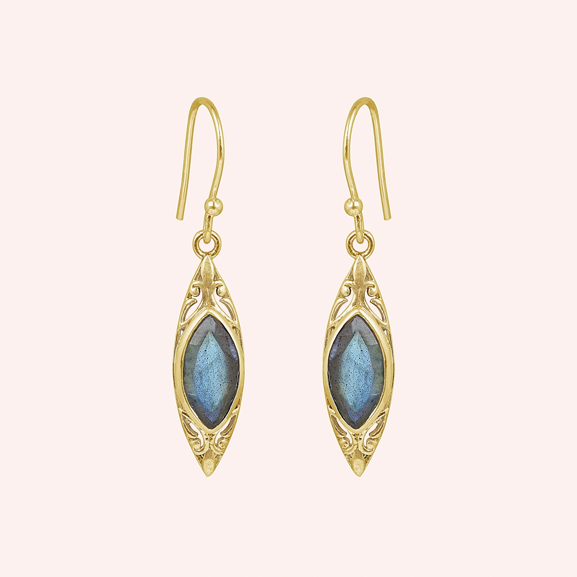 Gold plated marquise earrings dangle design with decorative border and central labradorite viewed straight on pink background