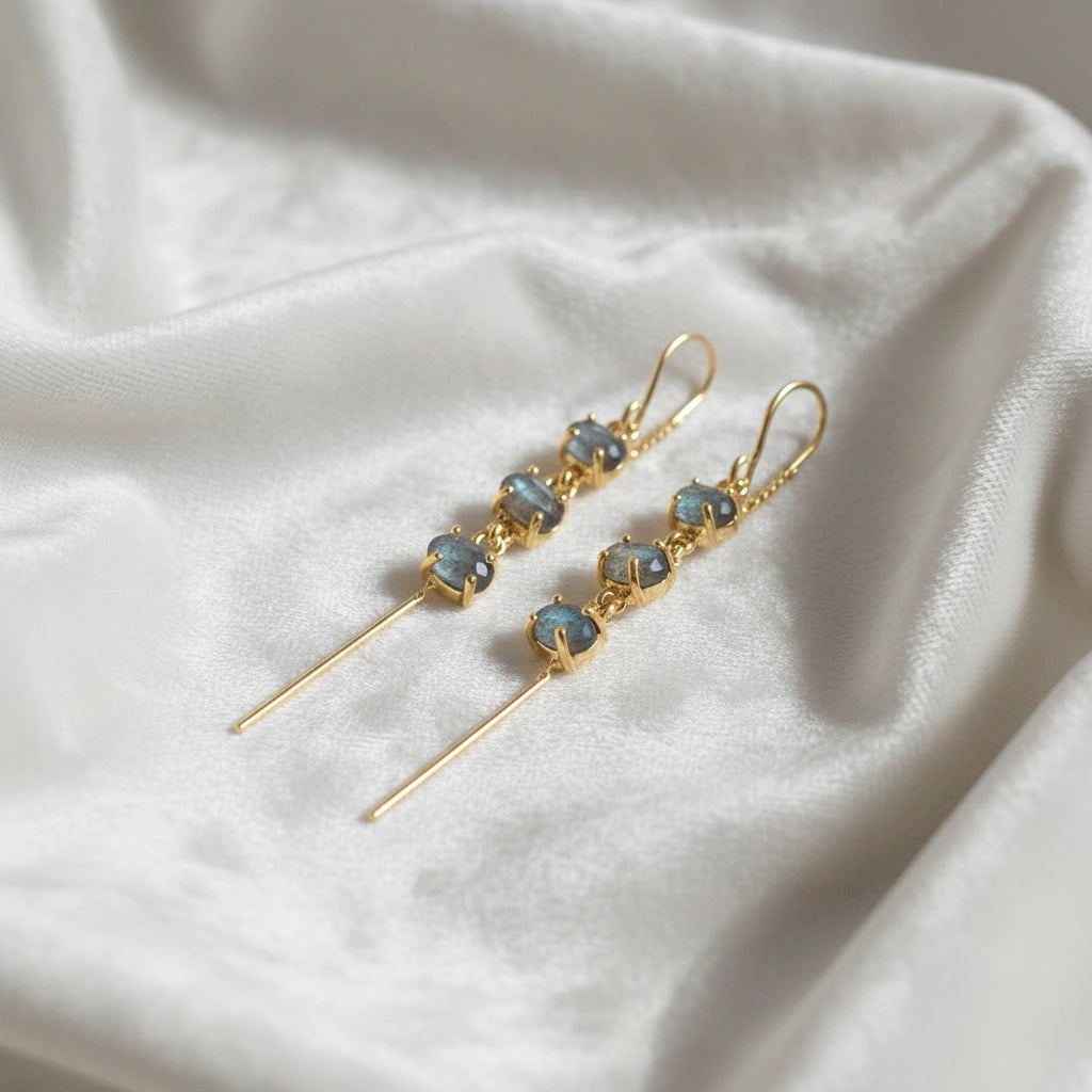 Gold plated threader earrings chain design with three linked labradorite stones angled slightly on white draped fabric
