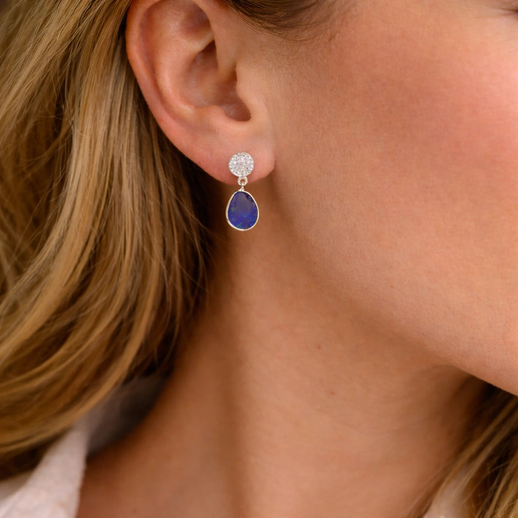 Lapis_lazuli_earrings_in_gold_plated_silver_with_lapis_lazuli_and_cz_stones_worn_by_a_model