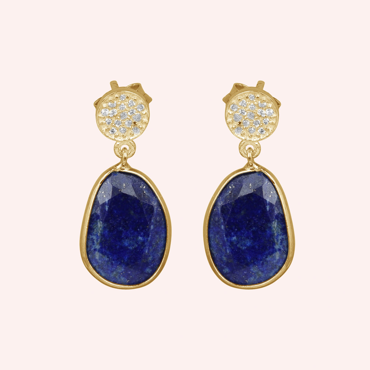 Lapis_lazuli_earrings_in_gold_plated_silver_with_lapis_lazuli_and_cz_stones_in_front_angle_on_a_solid_pink_background