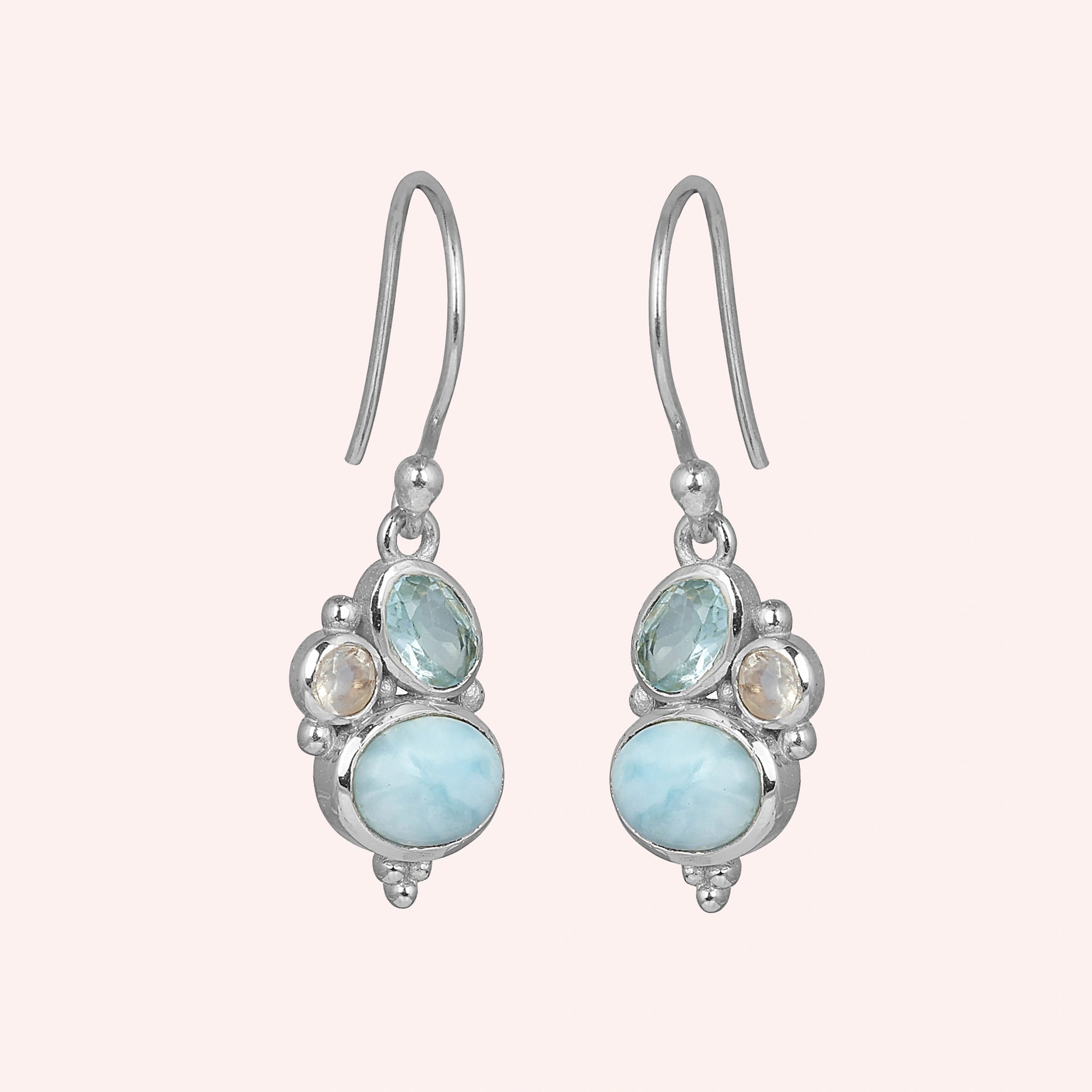 Boho dangle earrings sterling silver trio gemstones larimar moonstone blue topaz on light pink background view