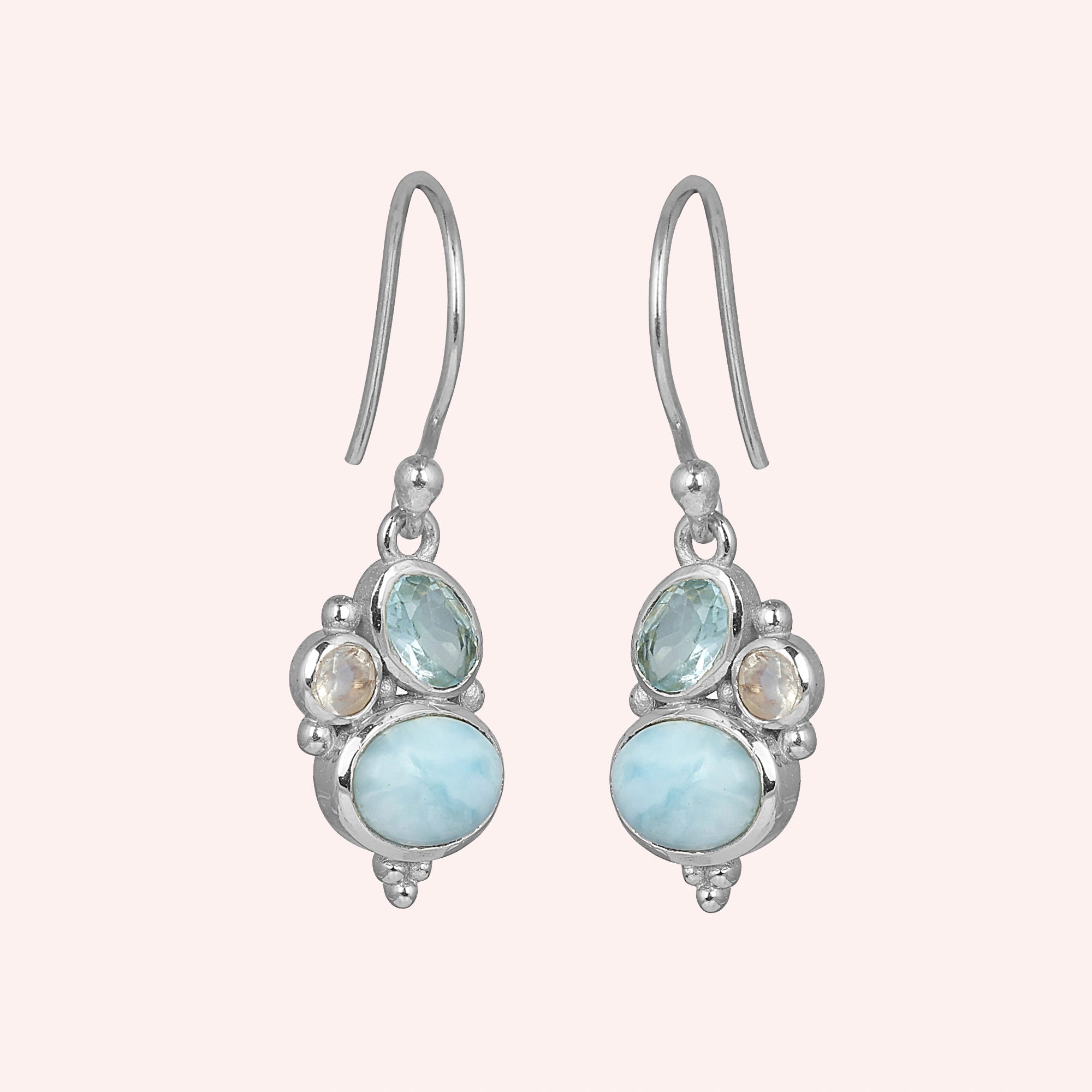 Boho dangle earrings sterling silver trio gemstones larimar moonstone blue topaz on light pink background view