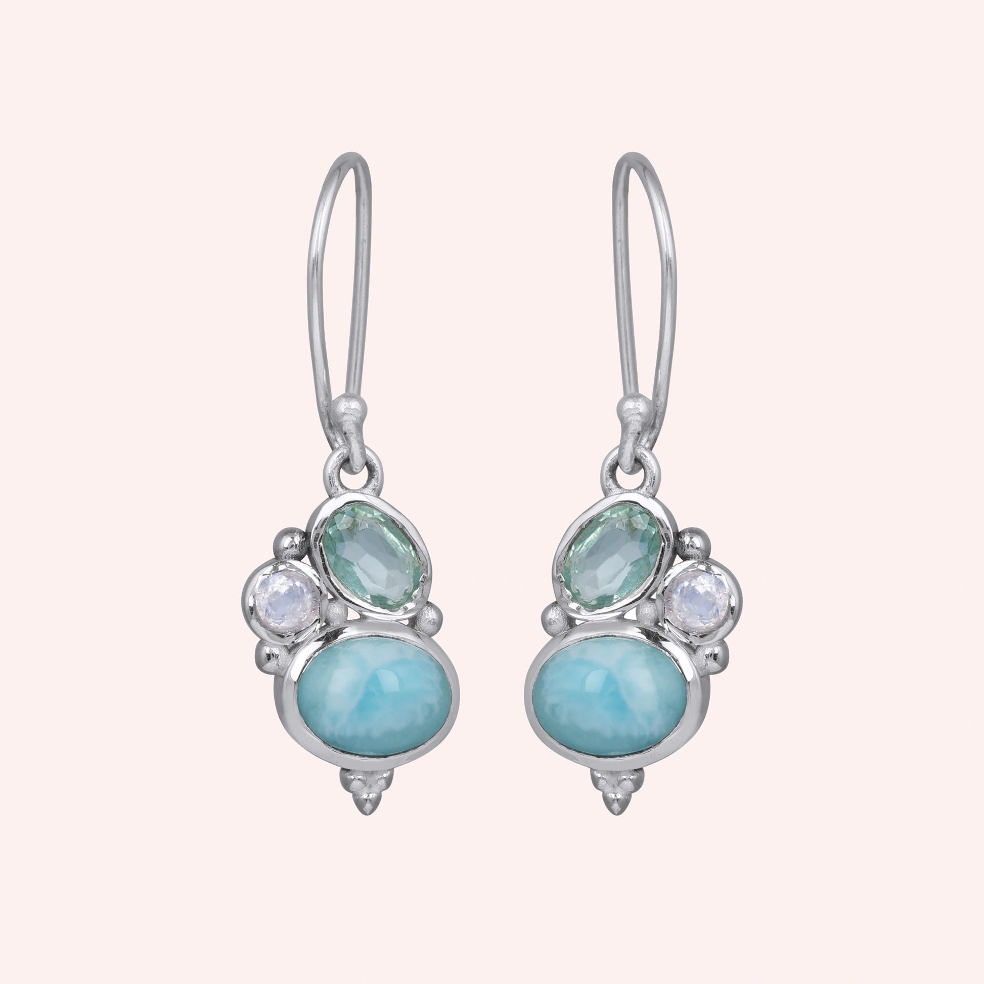 Boho dangle earrings sterling silver trio gemstones larimar moonstone blue topaz on light pink background with slightly angle