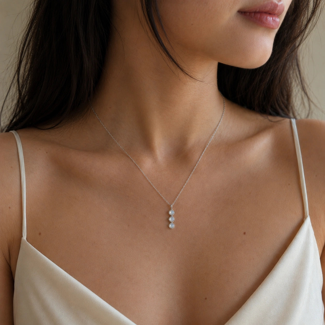 Layering_necklace_in_sterling_silver_featuring_moonstone_drop_worn_by_a_model