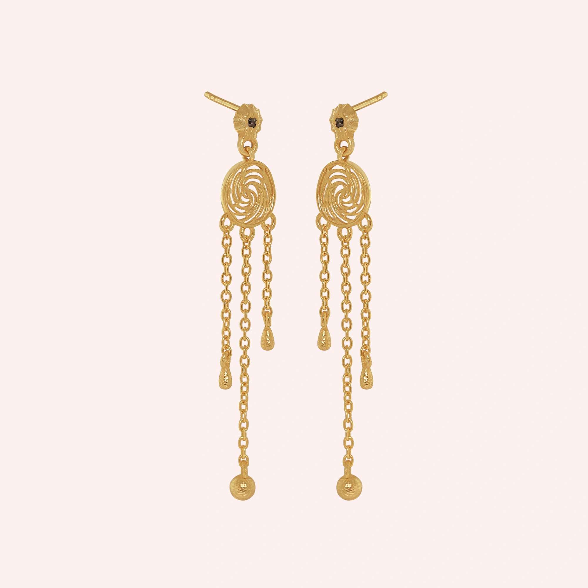 Long_chain_earrings_in_gold_plated_silver_featuring_smoky_quartz_stone_at_slight_angle_on_solid_pink_background