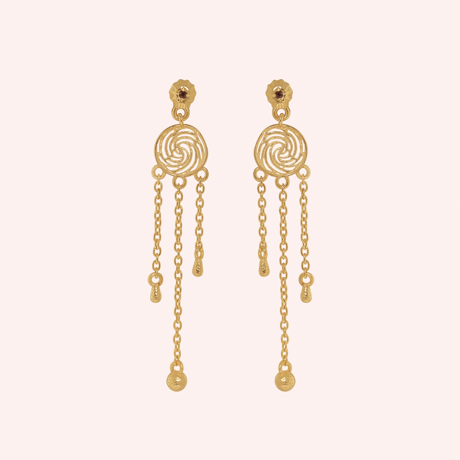 Long_chain_earrings_in_gold_plated_silver_featuring_smoky_quartz_stone_at_front_angle_on_solid_pink_background