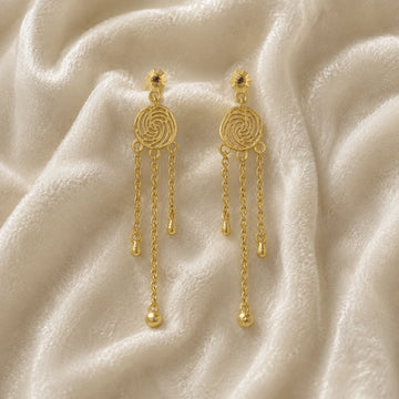 Long_chain_earrings_in_gold_plated_silver_featuring_smoky_quartz_stone_at_front_angle_on_soft_fabric_background