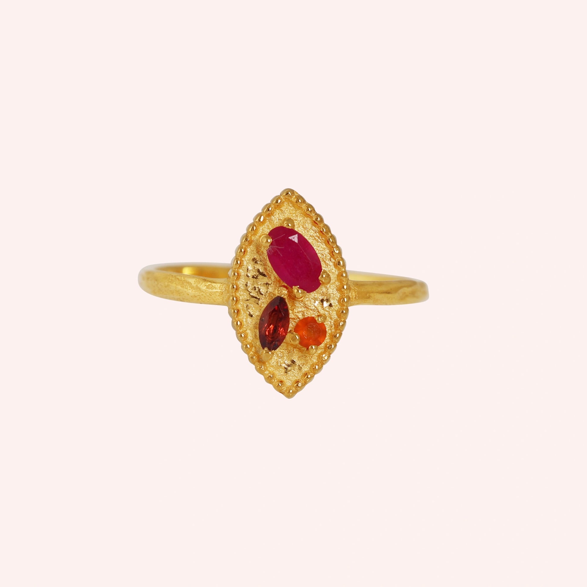 Marquise-ring-with-ruby-garnet-and-carnelian-stones-gold-plated-silver-front-view-on-soft-pink-background