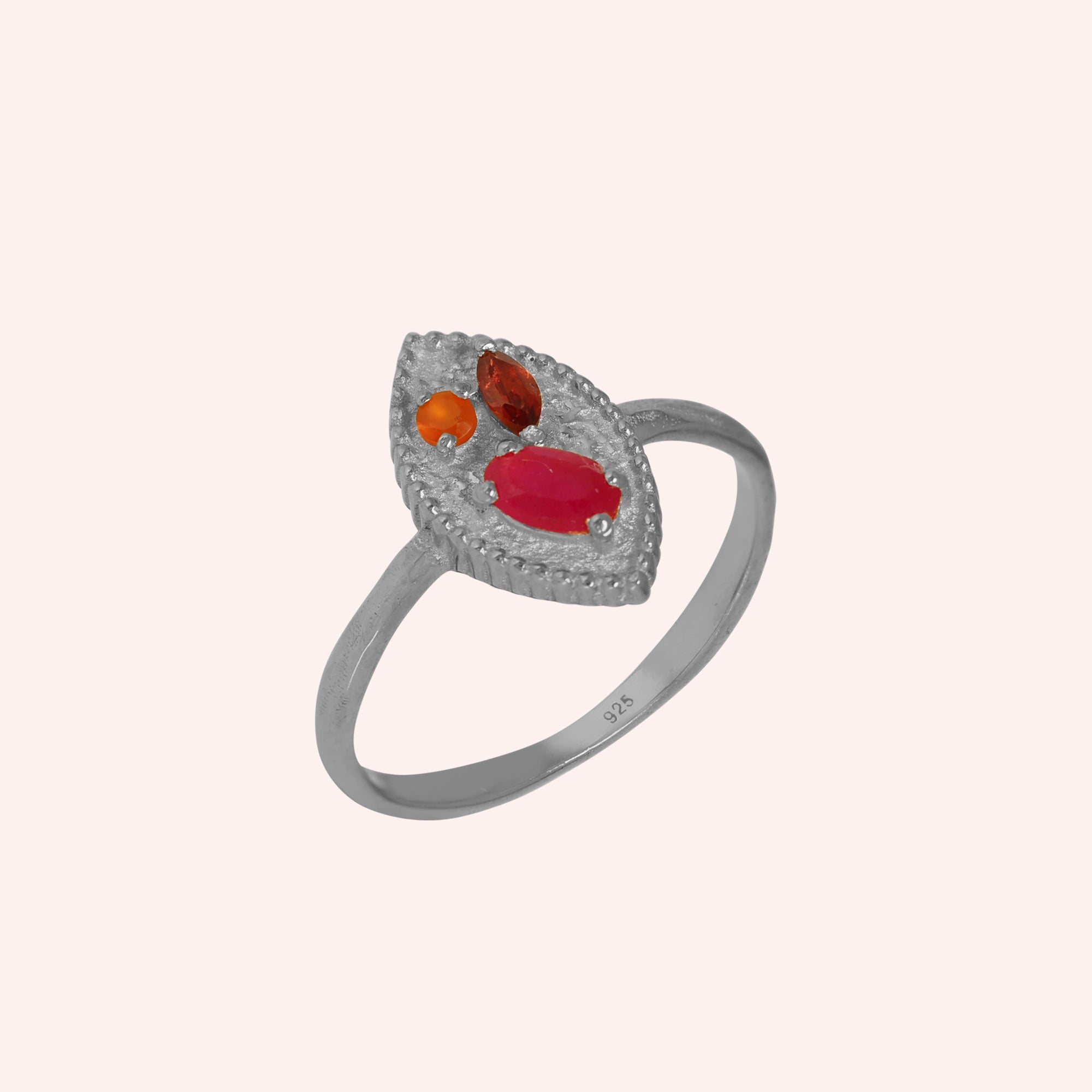 Marquise-ring-with-ruby-garnet-and-carnelian-stones-sterling-silver-front-view-on-soft-pink-background