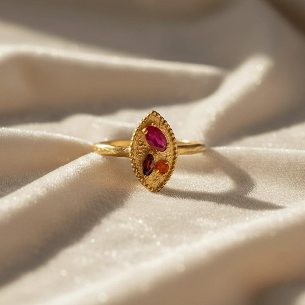 Marquise-ring-with-ruby-garnet-and-carnelian-stones-gold-plated-silver-front-view-on-white-satin-background