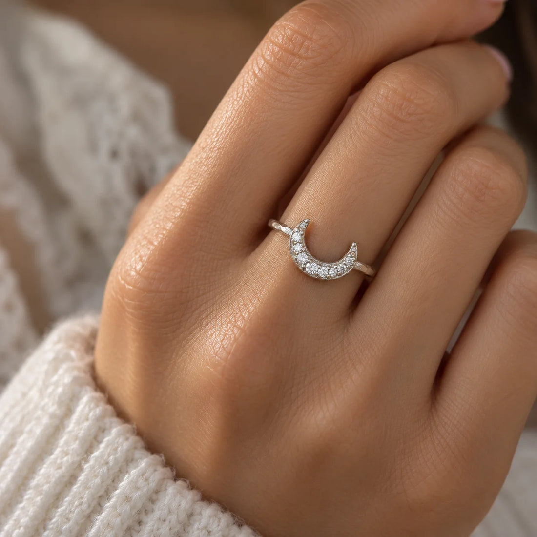 Moon_ring_in_gold_plated_silver_with_a_crescent_moon_design_at_front_angle_view_on_soft_fabric_background