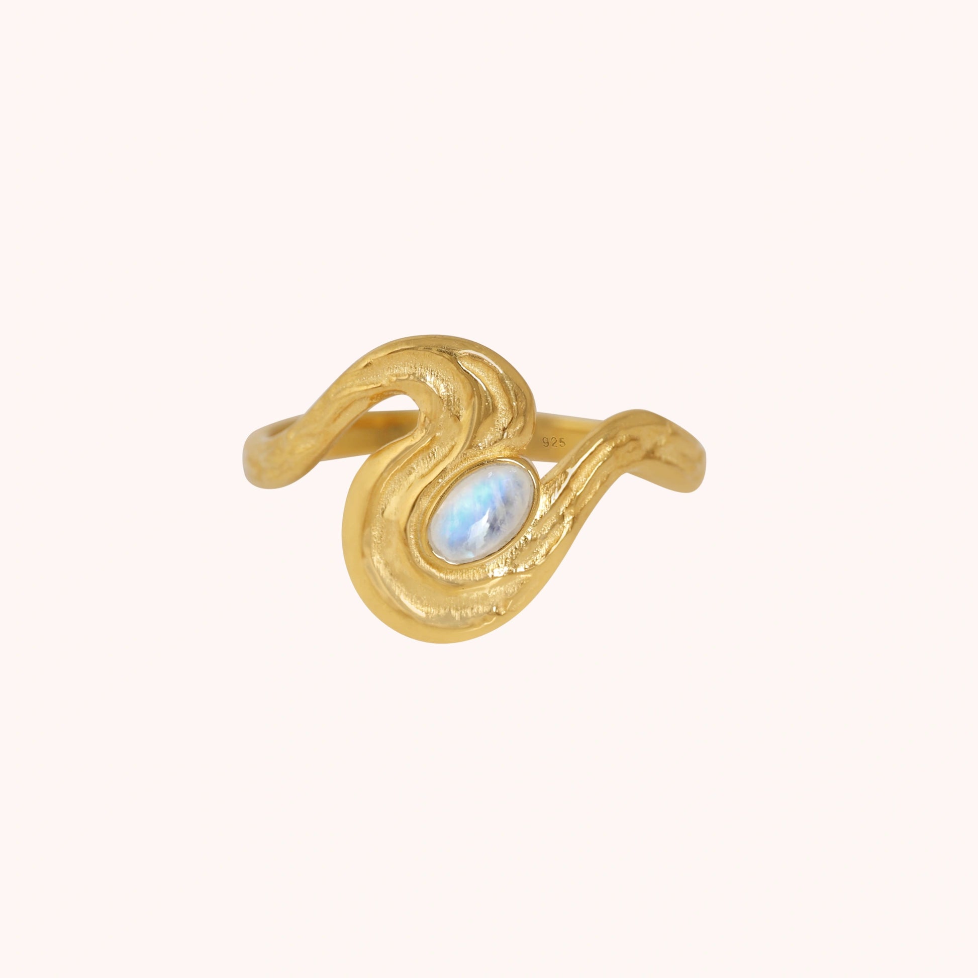 Moonstone_designer_ring_in_gold_plated_silver_with_moonstone_and_wave_band_shown_at_front_angle_view_on_soft_pink_background
