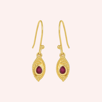 Pink_earrings_in_gold_plated_silver_with_pear_ruby_stones_at_front_angle_view_on_solid_pink_background