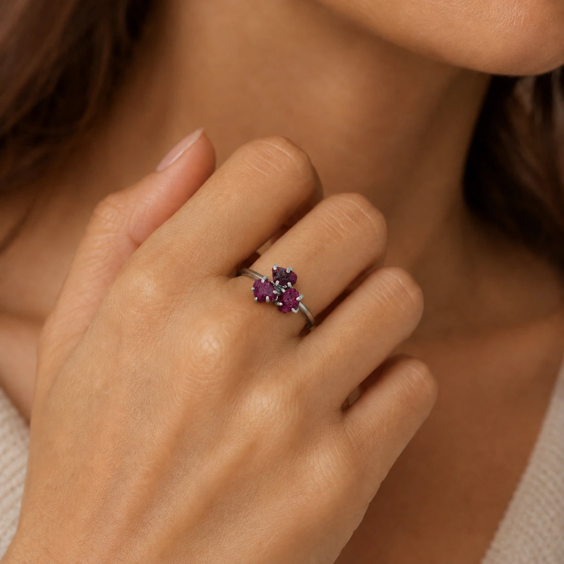 Pink_ring_in_gold_plated_silver_with_raw_tourmaline_stones_at_slight_angle_view_on_soft_fabric_background