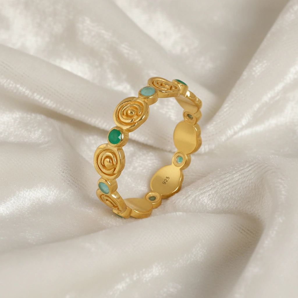 Rose-ring-with-green-and-blue-gemstones-gold-plated-silver-angled-view-on-white-satin-background