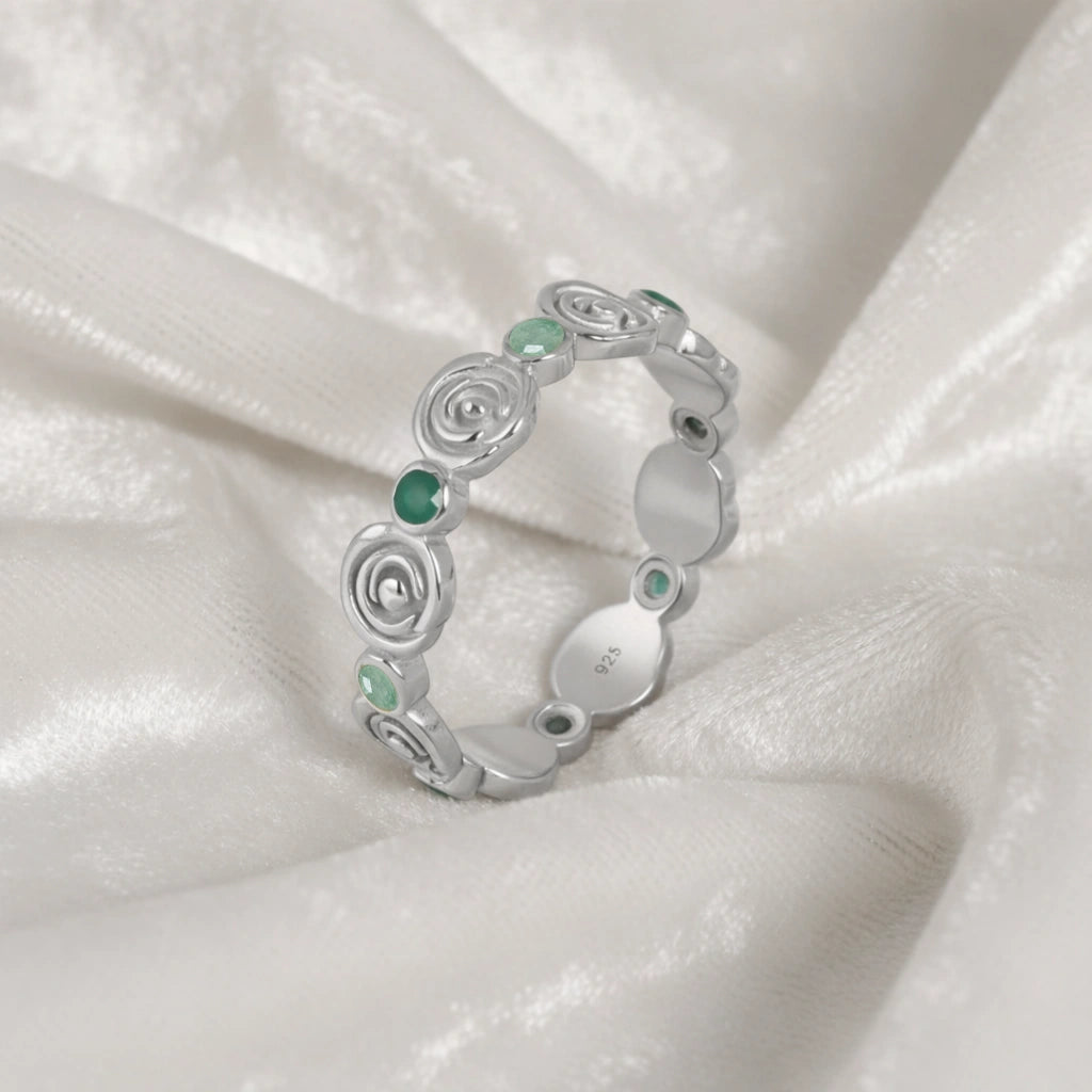 Rose-ring-with-green-and-blue-gemstones-sterling-silver-angled-view-on-white-satin-background