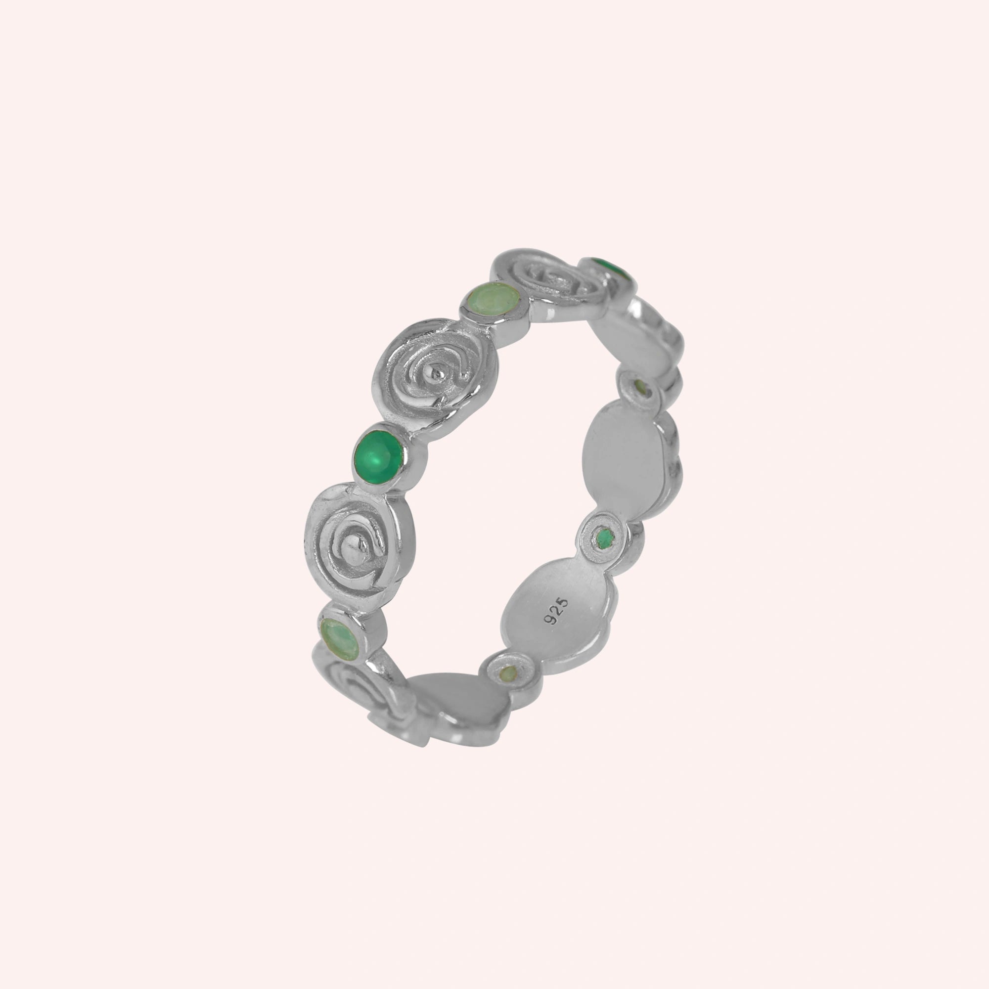 rose-ring-with-green-and-blue-gemstones-sterling-silver-angled-view-on-soft-pink-background