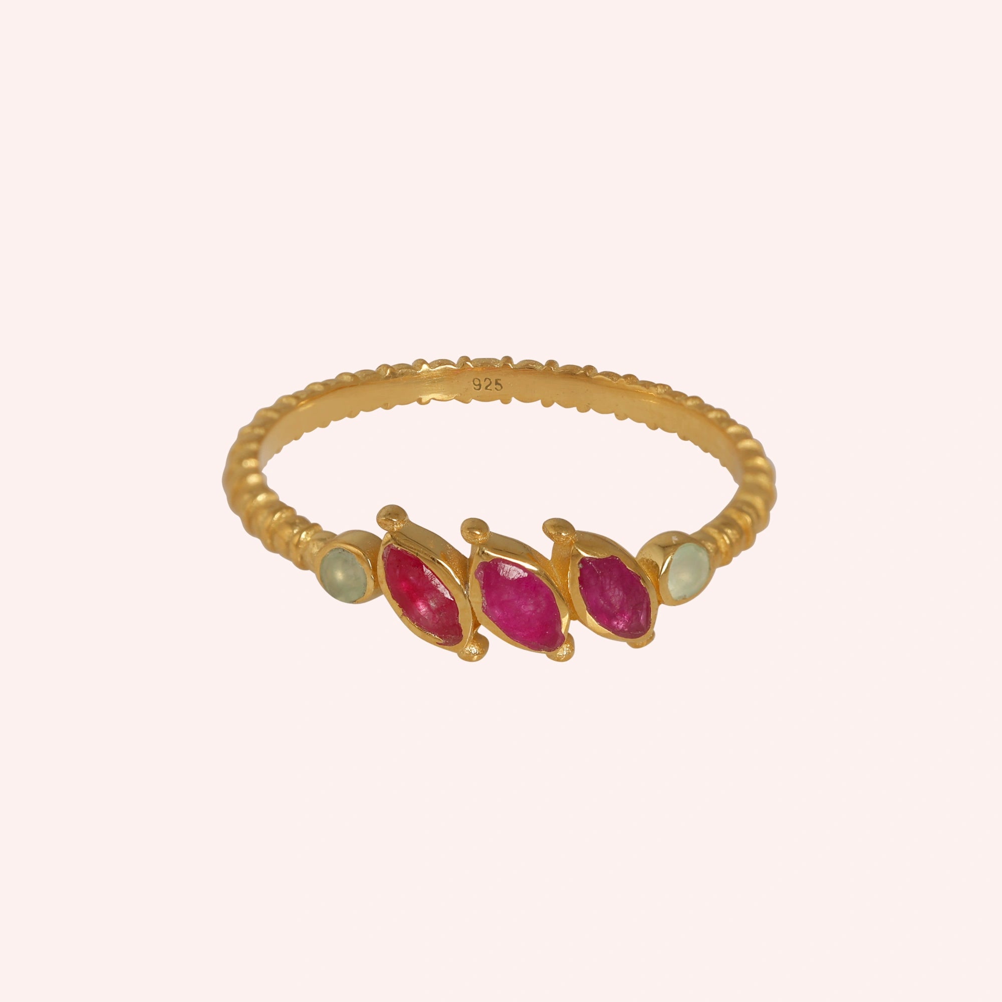Ruby-ring-with-pink-and-green-gemstones-gold-plated-silver-front-view-on-solid-pink-background