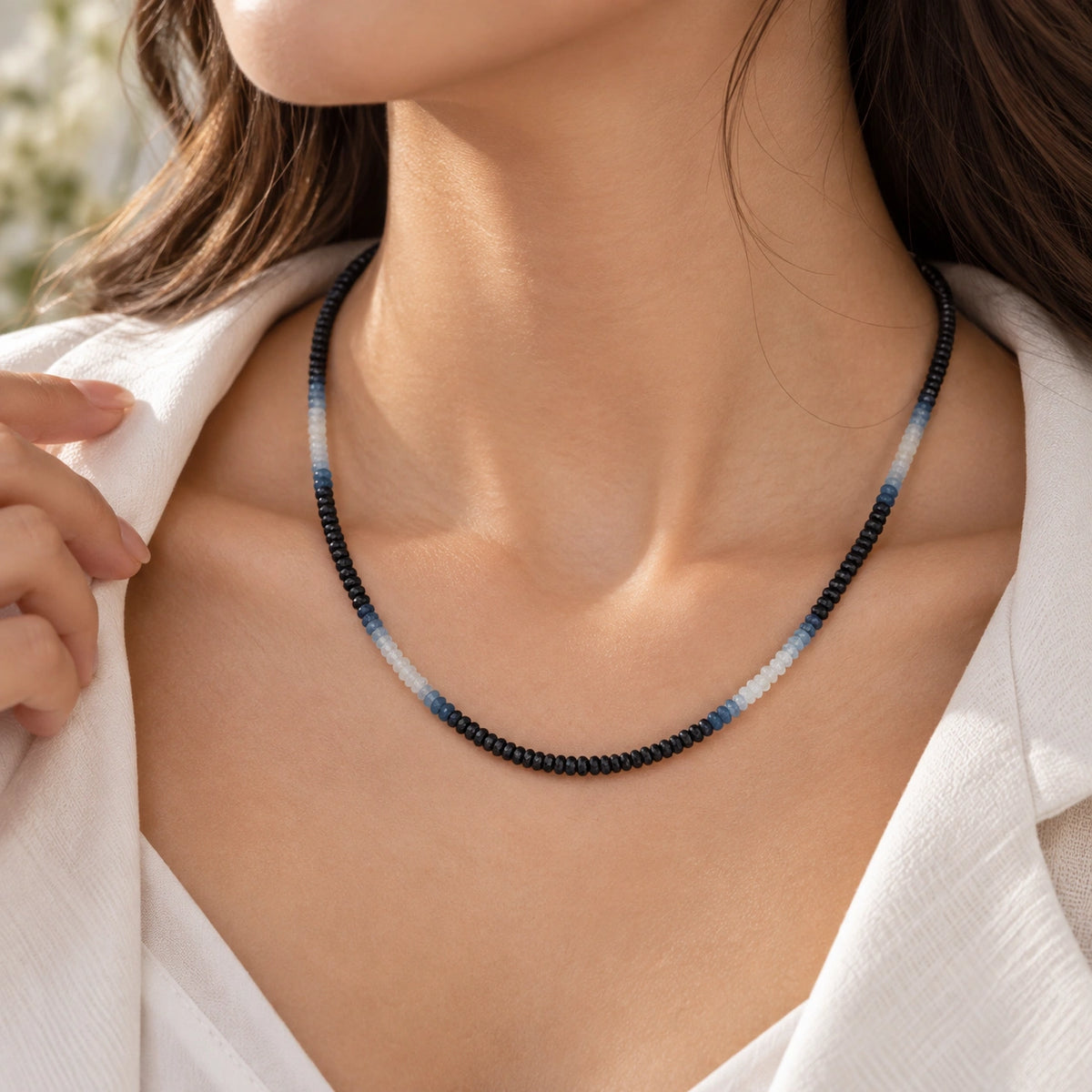 Sapphire_necklace_in_ombre_effect_with_sapphire_stones_in_gradient_design_worn_by_a_model