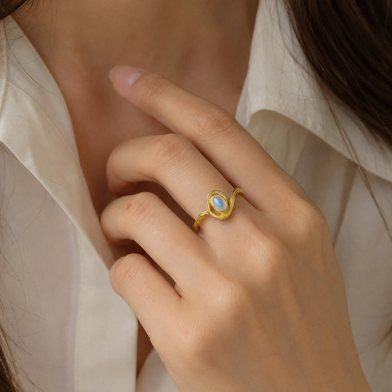 Moonstone_ring_with_gold_plated_silver_wave_band_worn_by__model