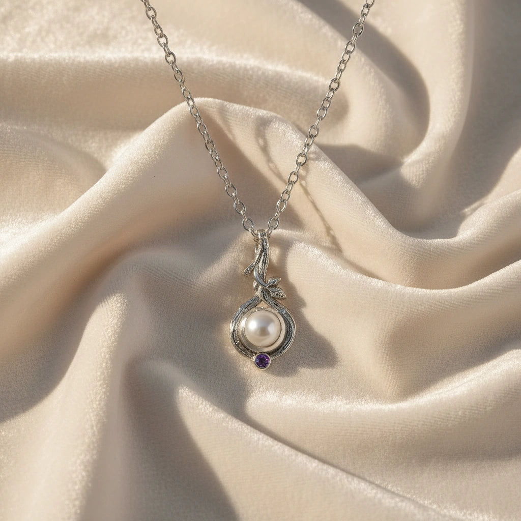 Front_angle_silver_pearl_necklace_with_round_pearl_and_amethyst_accent_amethyst_pearl_necklace_on_soft_satin_background