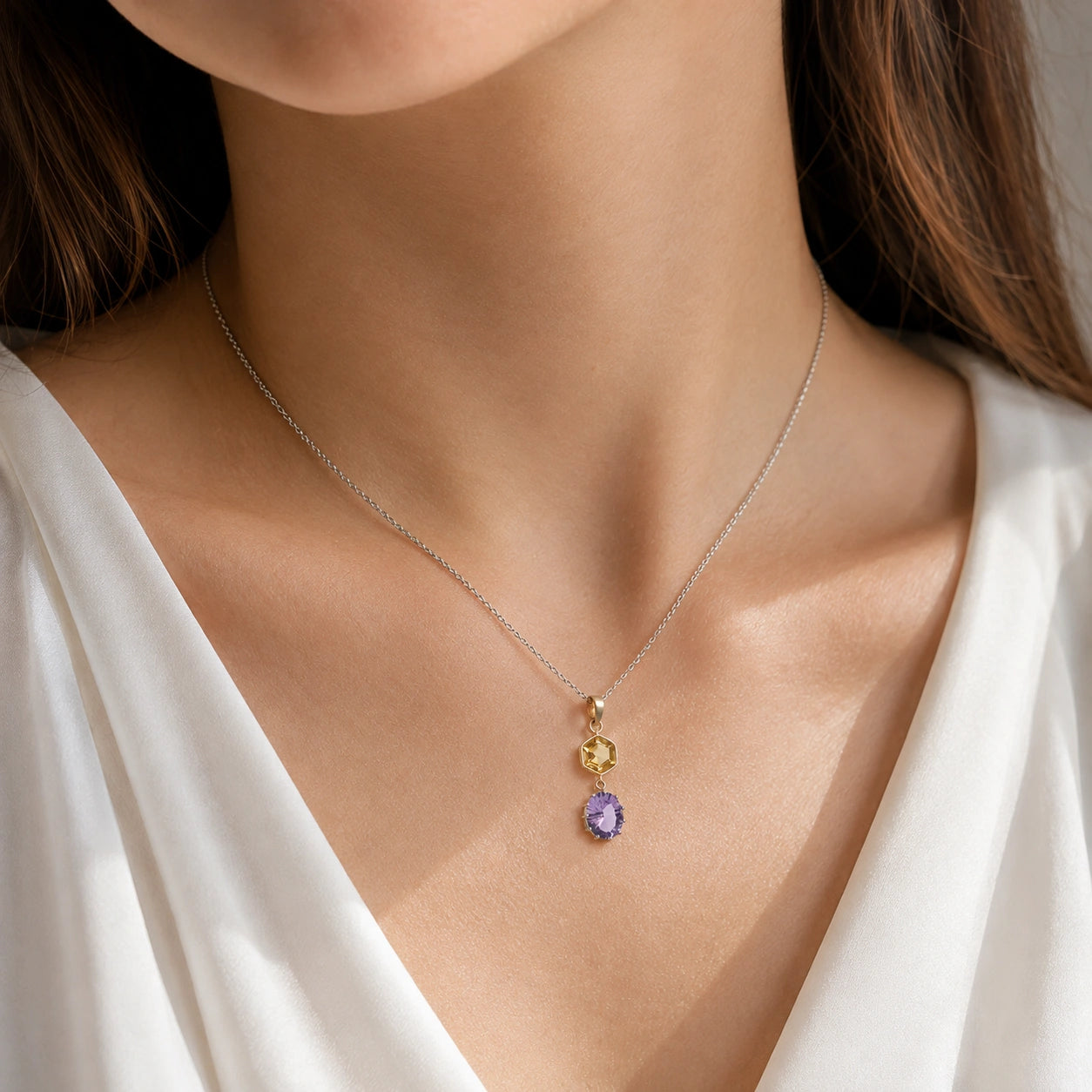 Silver_pendant_necklace_with_amethyst_and_citrine_stones_in_sterling_silver_worn_by_a_model