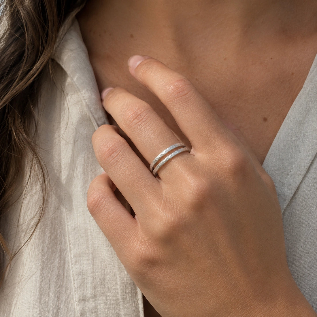 Simple_gold_ring_in_gold_plated_silver_with_split_band_at_slight_angle_on_soft_fabric_background