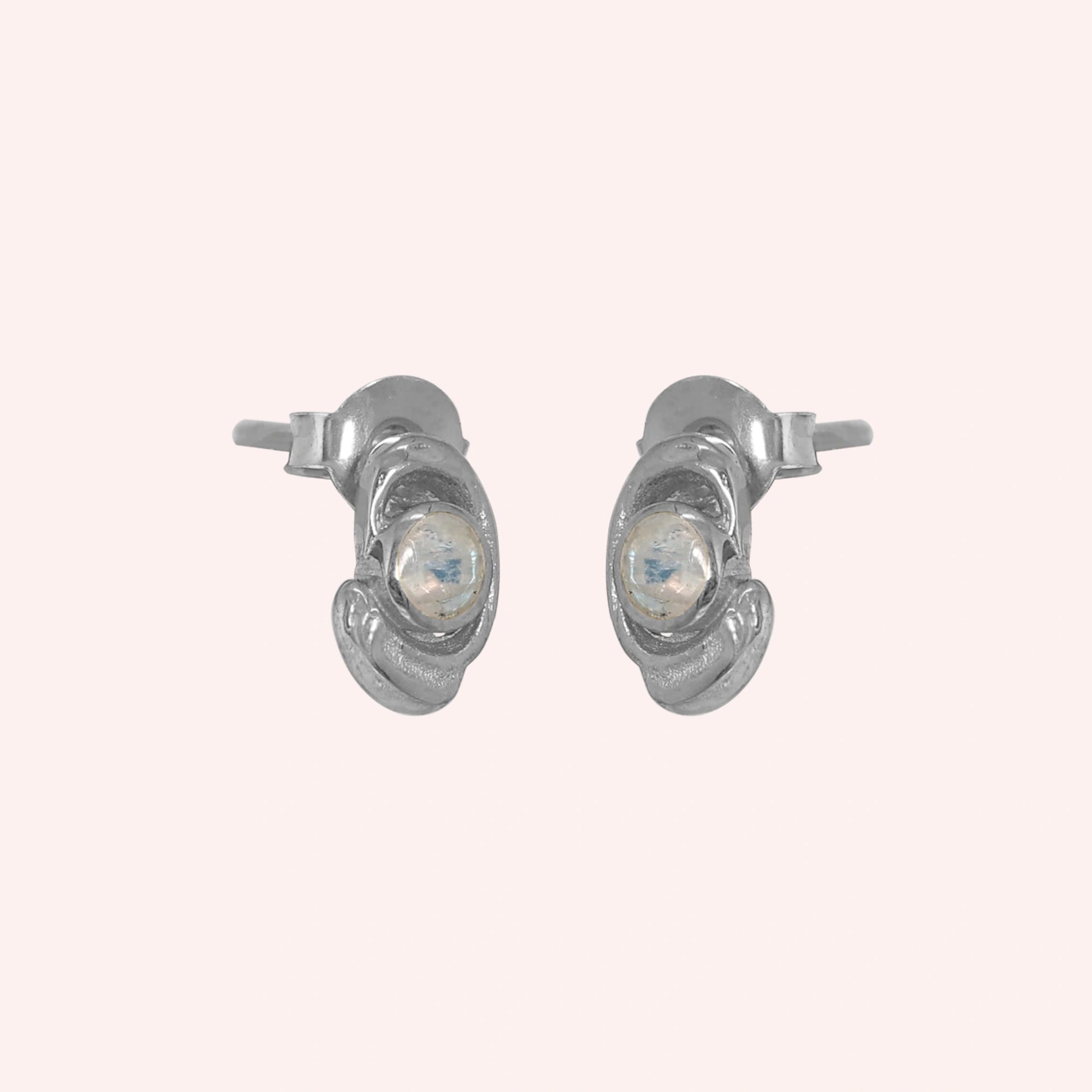 Small-stud-earrings-with-moonstone-sterling-silver-slight-angled-view-on-soft-pink-background