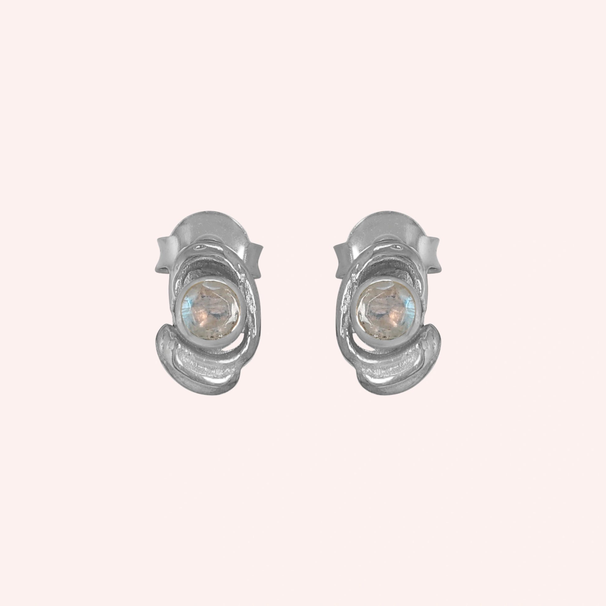 Small-stud-earrings-with-moonstone-sterling-silver-front-view-on-soft-pink-background