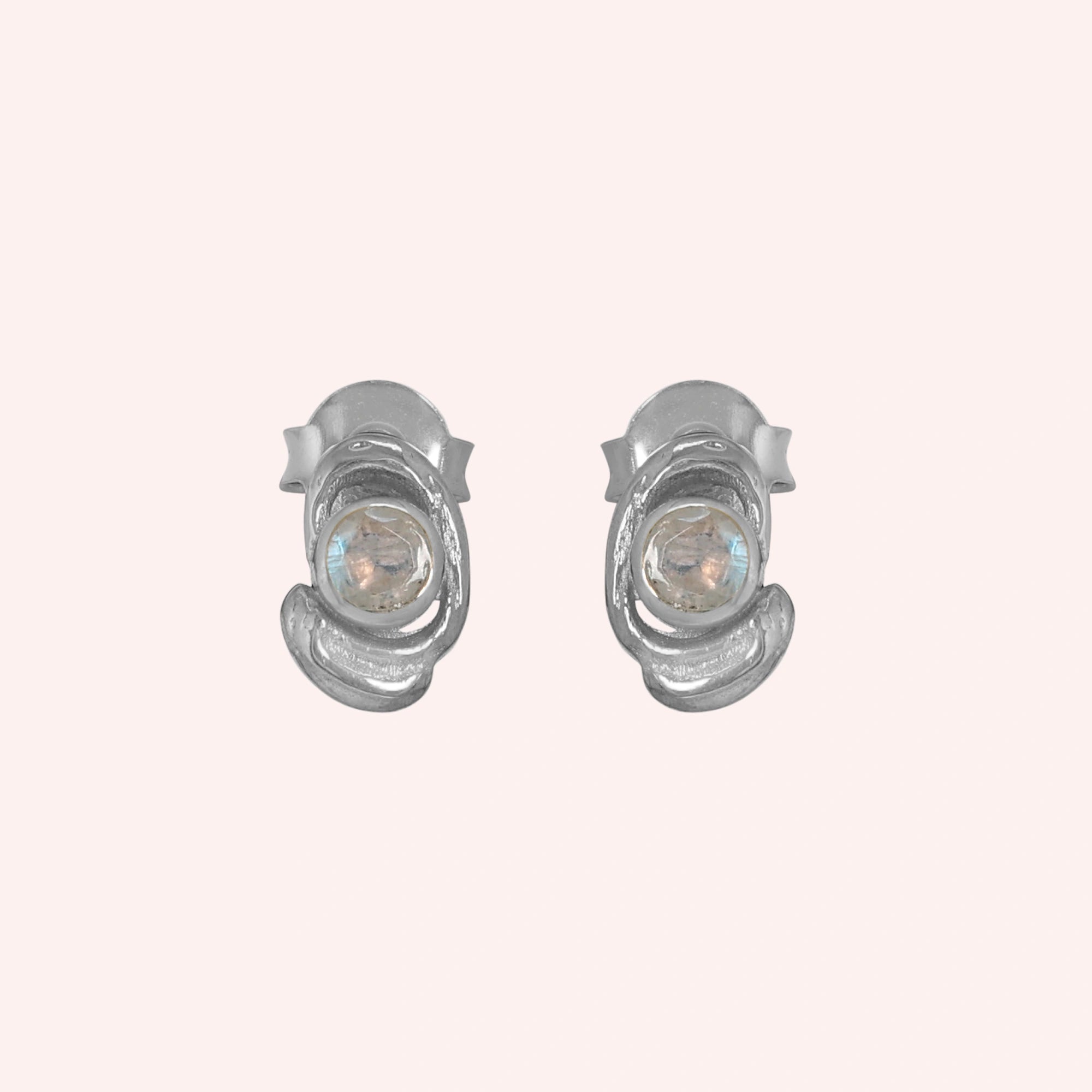 Small-stud-earrings-with-moonstone-sterling-silver-front-view-on-soft-pink-background