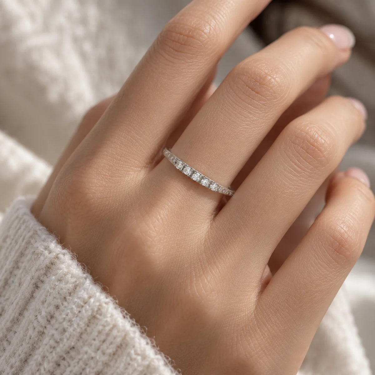 Stackable_ring_in_sterling_silver_with_lab_grown_diamonds_at_front_angle_view_worn_by_a_model