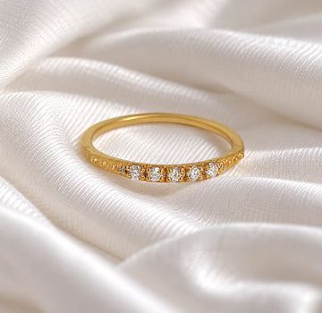 Stackable_ring_in_gold_plated_silver_with_lab_grown_diamonds_at_front_angle_view_on_soft_fabric_background