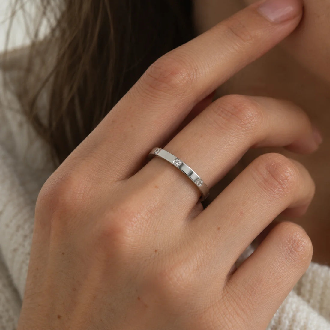 Stacking_ring_in_gold_plated_silver_with_lab_grown_diamonds_at_front_angle_view_on_soft_fabric_background