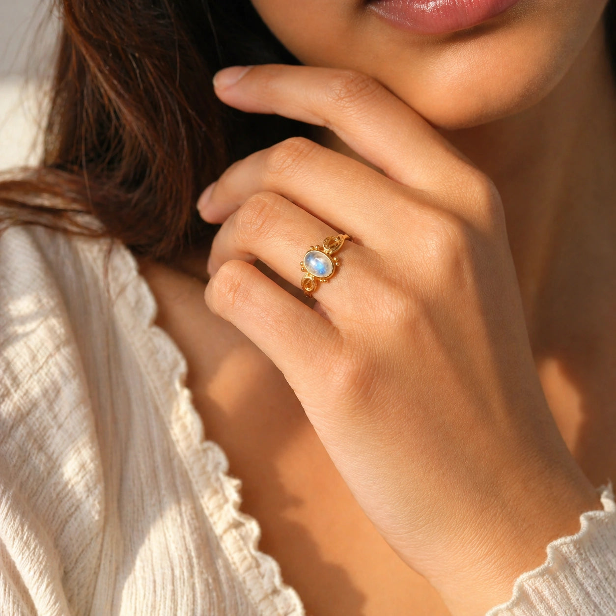 Statement_ring_gold_plated_silver_with_oval_moonstone_and_intricate_band_detail_worn_by_a_model