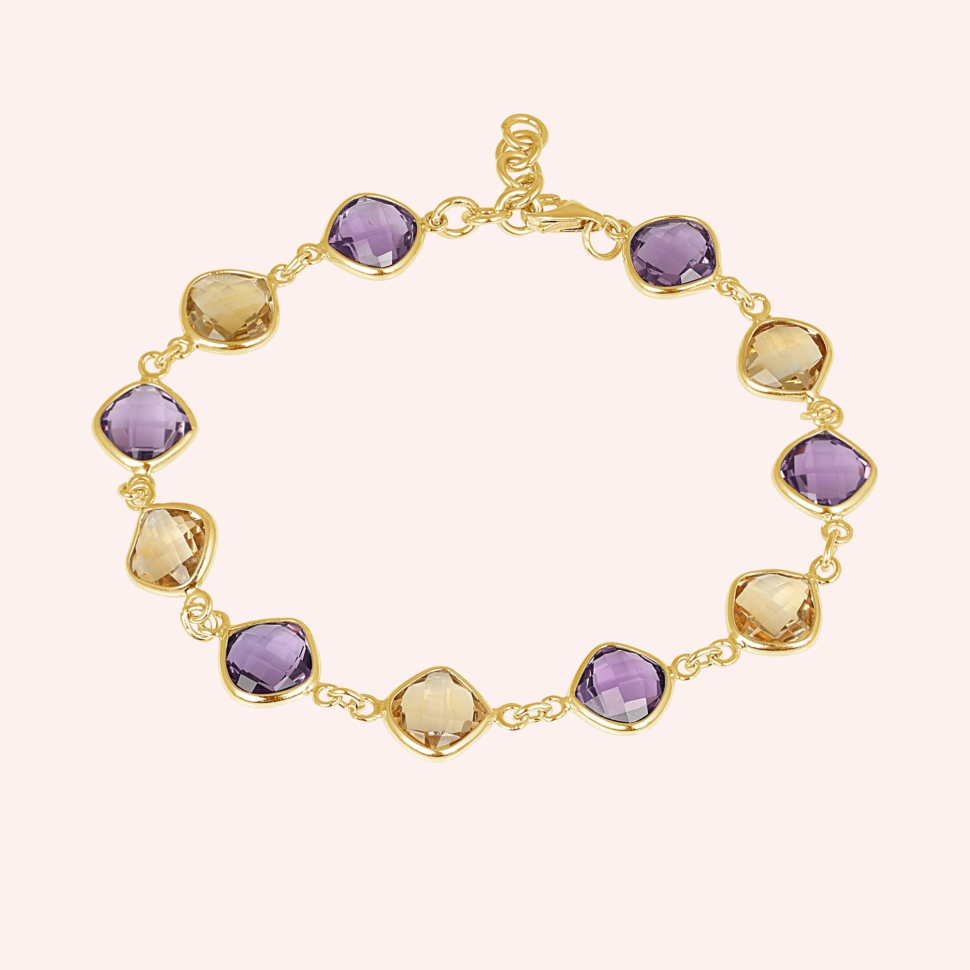sterling_silver_gemstone_bracelet_top_view_gold_plated_amethyst_citrine_bracelet_on_soft_pink_background