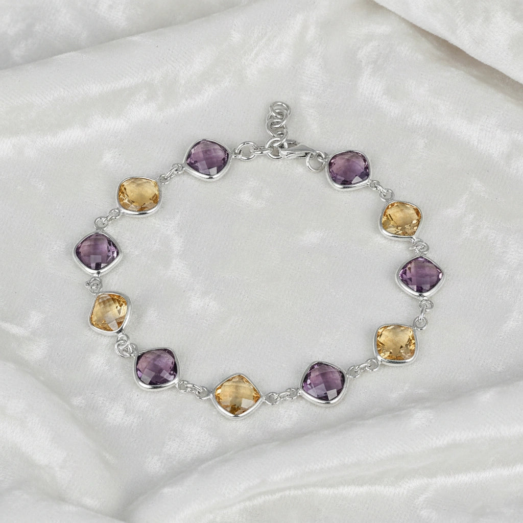 sterling_silver_gemstone_bracelet_top_view_amethyst_citrine_bracelet_on_white_velvet_background_soft_texture
