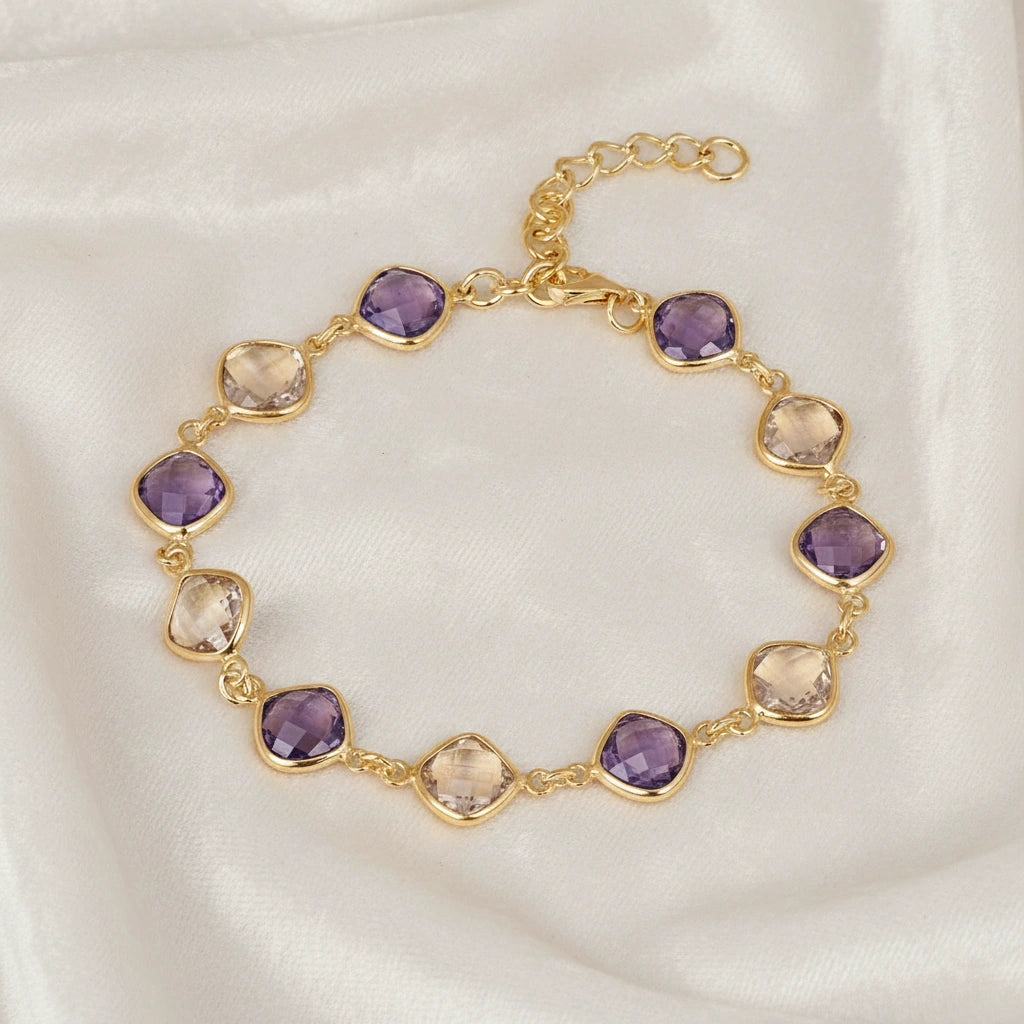 sterling_silver_gemstone_bracelet_top_view_gold_plated_amethyst_citrine_bracelet_on_white_velvet_background_soft_texture