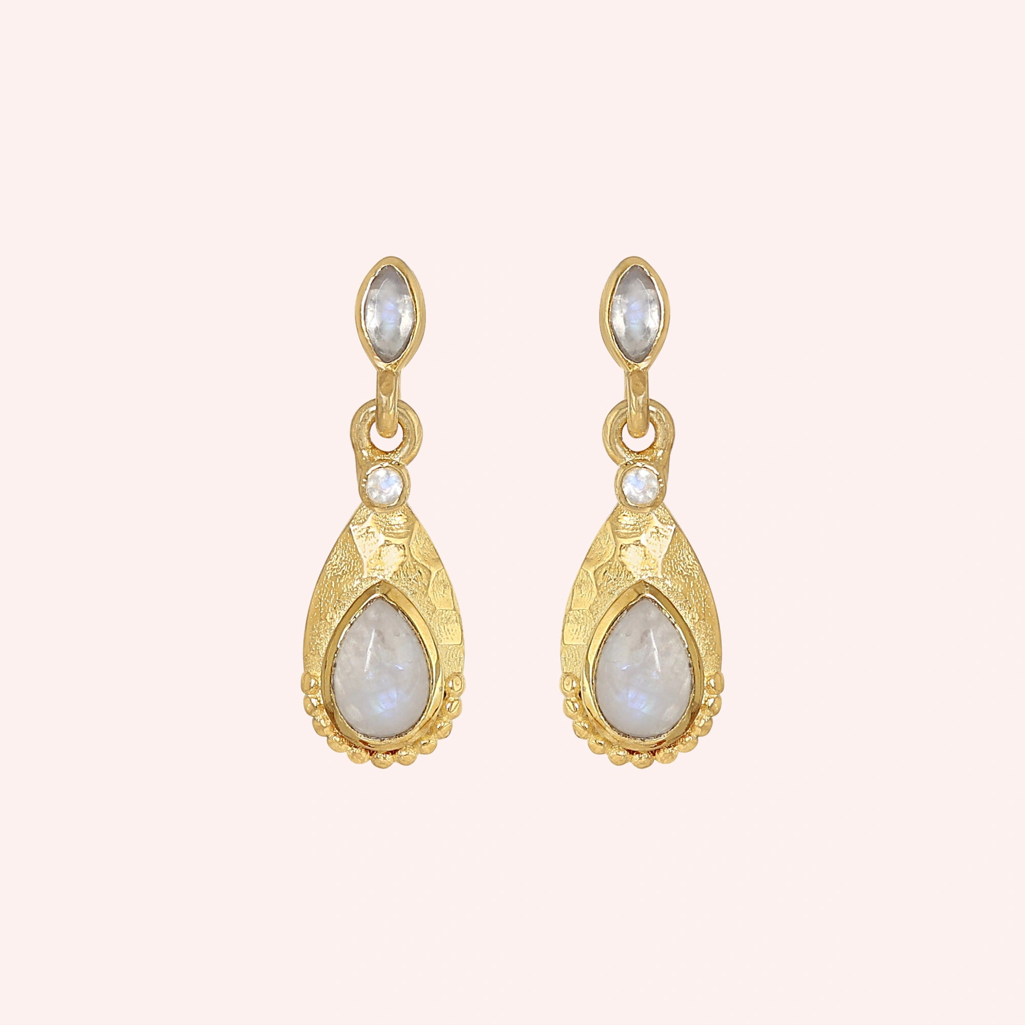 Teardrop_earrings_gold_plated_silver_with_moonstone_in_front_angled_view_on_solid_pink_background