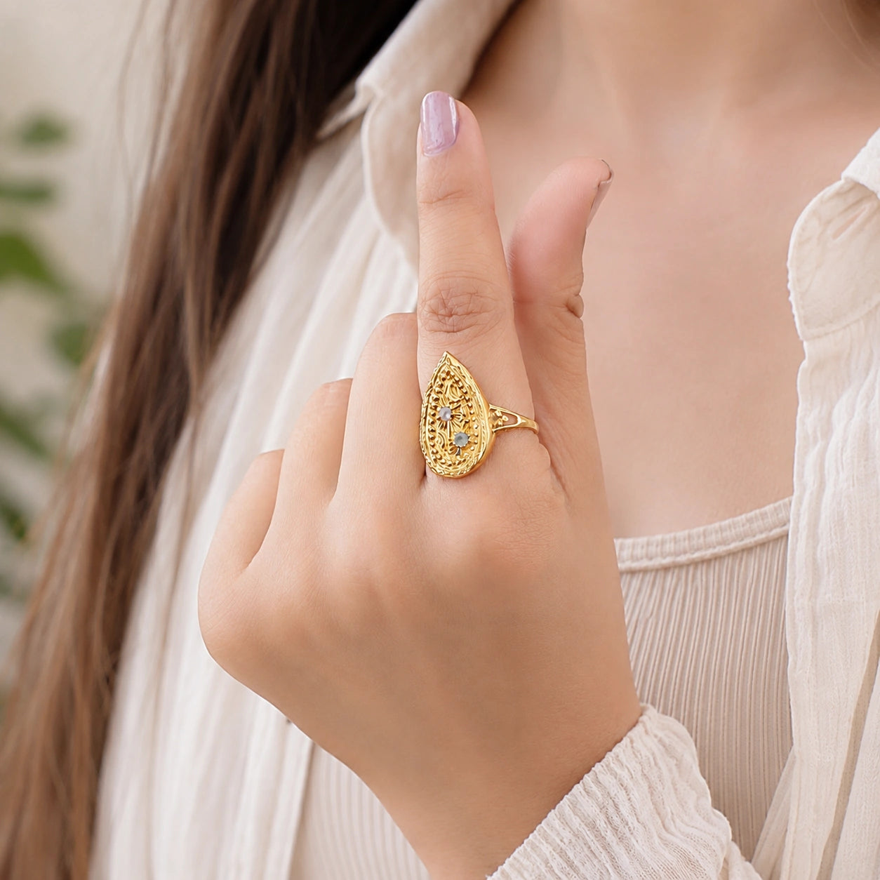 Teardrop Celestial Ring with labradorite word by a model