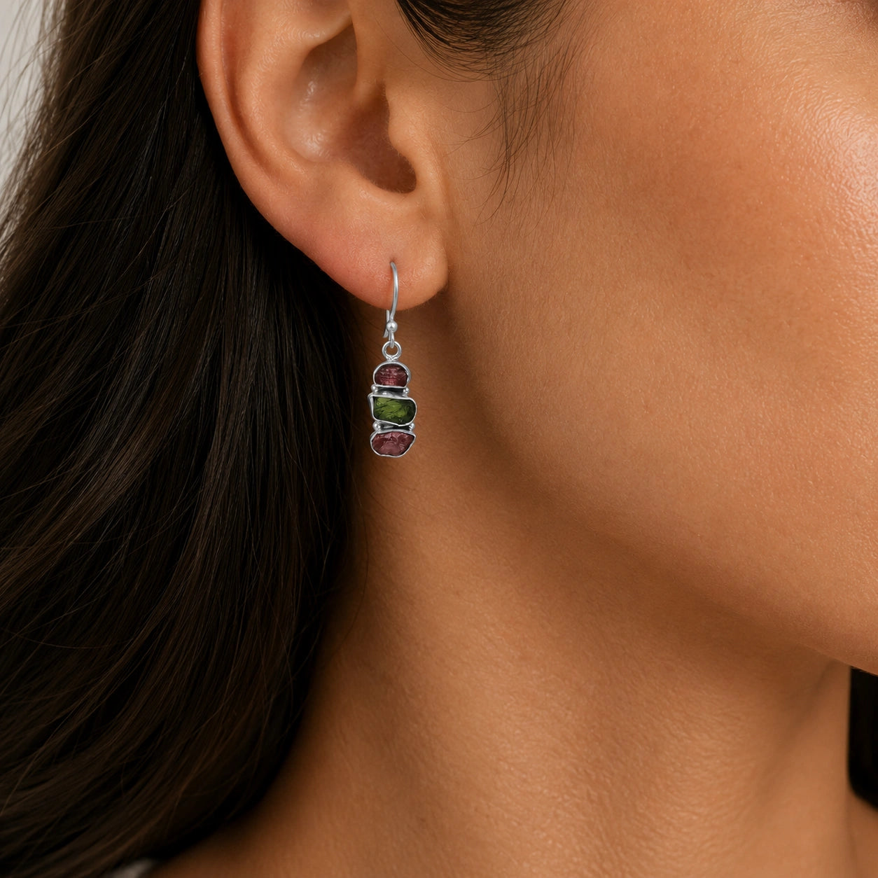 Trending_earrings_in_sterling_silver_with_three_raw_tourmaline_stones_worn_by_a_model