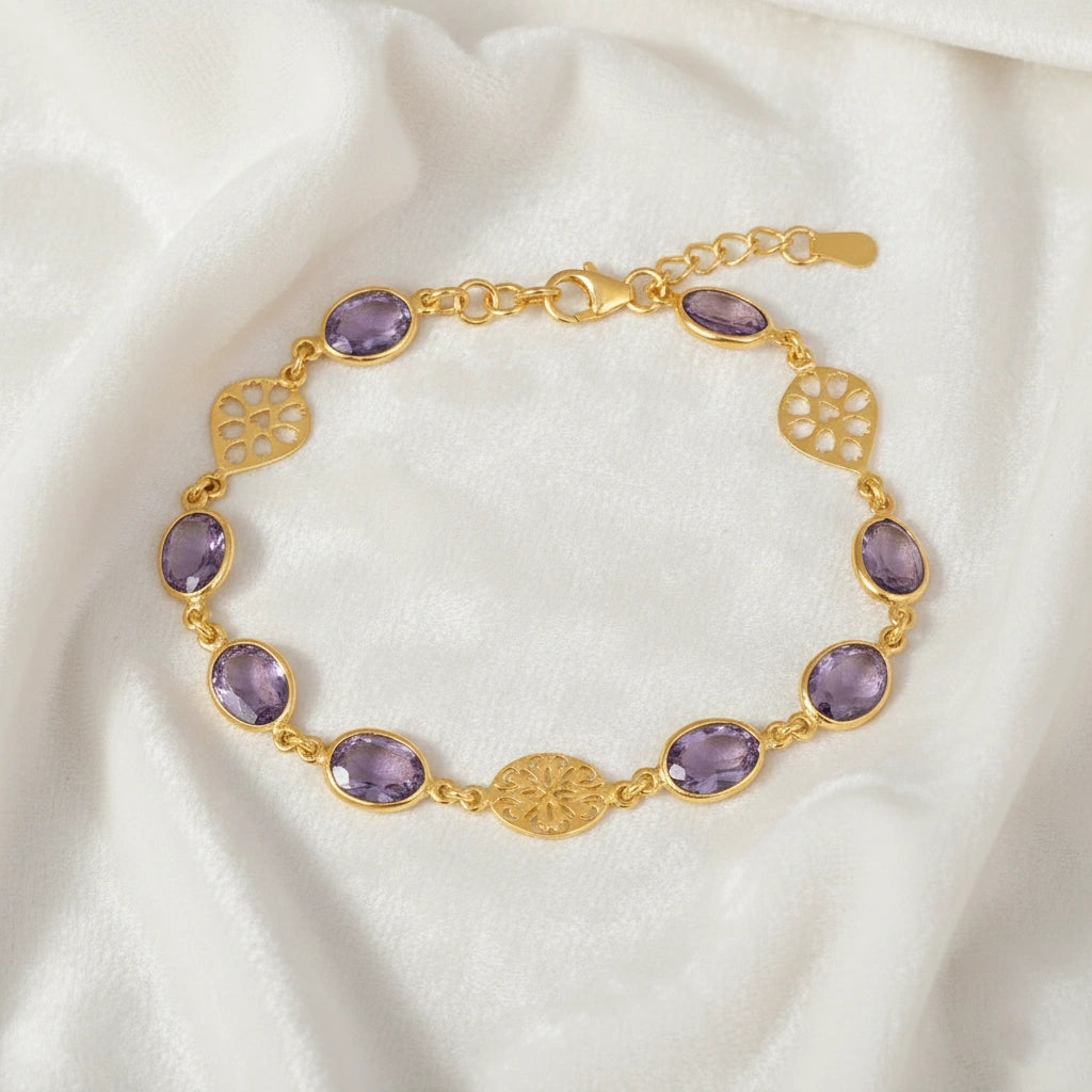 vintage_amethyst_bracelet_top_angle_gold_plated_oval_purple_gemstones_amethyst_tennis_bracelet_on_white_silk_background