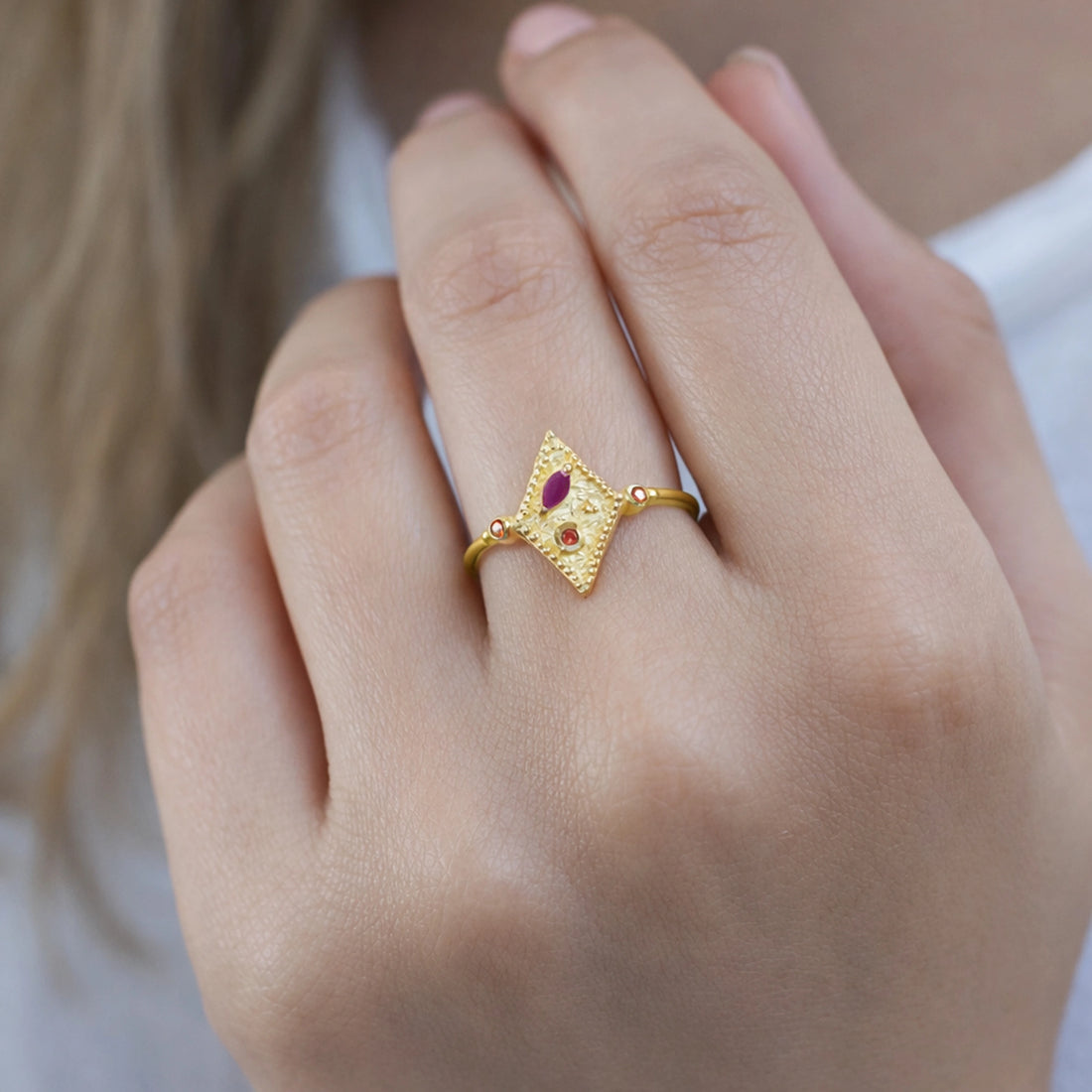 Vintage-ring-with-ruby-and-garnet-gemstones-gold-plated-silver-geometric-design-front-view-on-satin-background