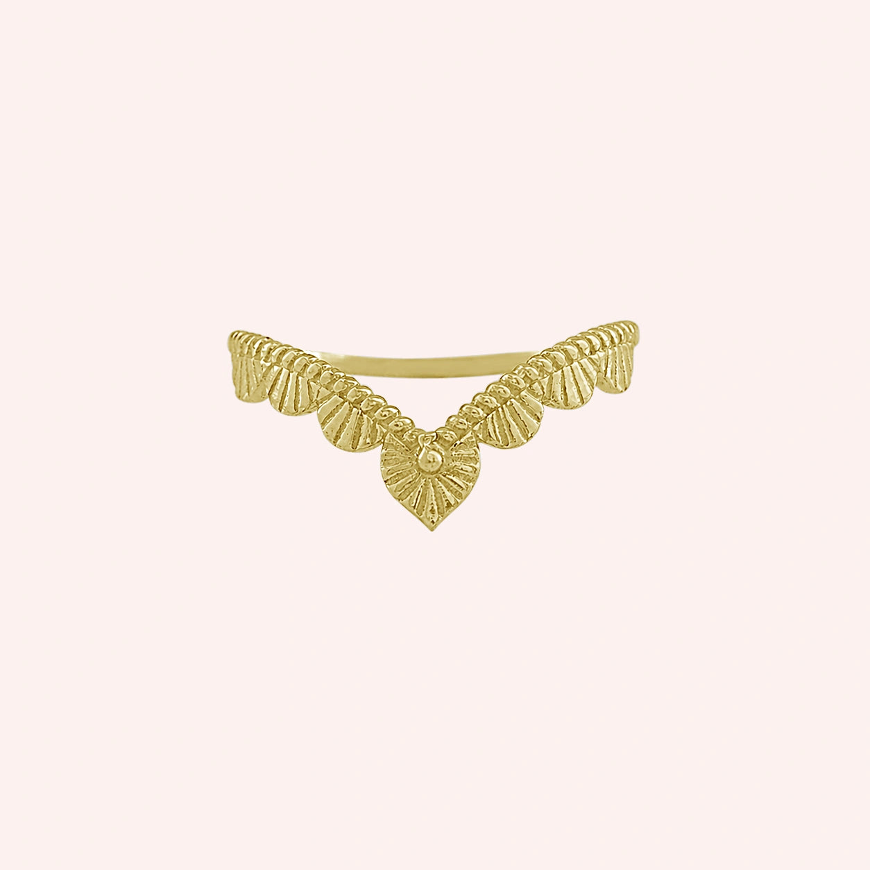 Wishbone_ring_in_gold_plated_silver_with_designed_v_shape_in_front_angle_view_on_solid_pink_background